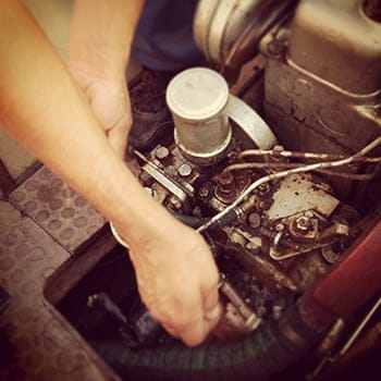 man repairing the motor